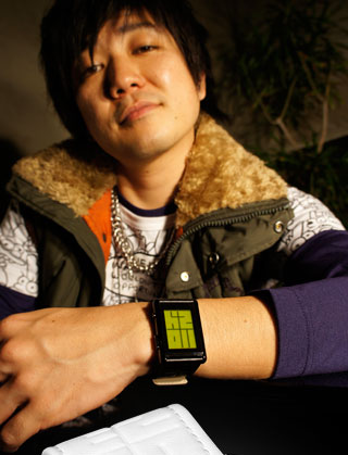 Guy wearing Stencil Green LCD watch