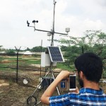 UW student Shahryar Ahmad helps set-up an automatic weather station that measures weather parameters in real time.