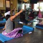 Participants practicing yoga during an ALMA pilot session.