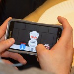 A CEE undergraduate student plays "LoosePoops" during an app testing event.