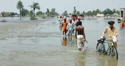 This photo, taken long after the initial floods hit in late July 2010, shows the significant effect of the monsoon on roads in the Muzaffargarrh district near central Pakistan. (Photo credit: World Vision)
