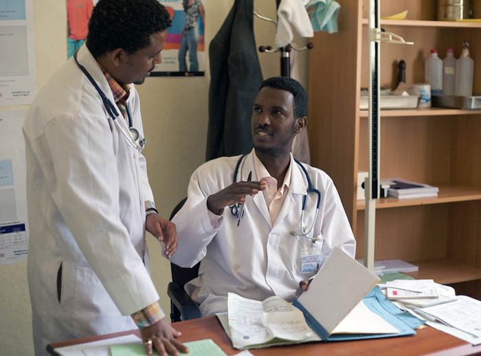 An I-TECH clinical mentor discusses a case with a doctor at the district hospital in Mekele, Ethiopia. I-TECH Ethiopia supports thirteen teams of clinical mentors who provide on-site support at public sector HIV care facilities across three large regions of the country.