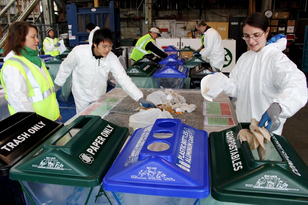 UW volunteers sort recyclable and compostable material at the 2011 UW Trash-In. From left, they are Nanda Guajardo of Recycling & Solid Waste, and students Martin Su and Krysta Yousoufian, both members of SEED (Students Expressing Environmental Dedication).