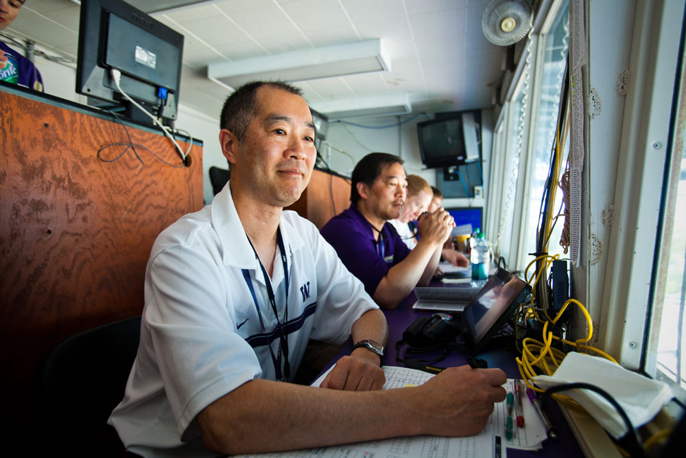 From left, Craig Heyamoto, his brother Gary Heyamoto and Dan Lepse are ready to keep statistics for another Husky game.