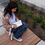Kalyn Marab, a student in an introduction to landscape architecture class, prepares a sketch in the new Community Design courtyard.