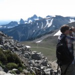 Tom Cotner is surrounded by the beauty of Rainier National Park, but hes focused on looking for a white-tailed ptarmigan hed seen on previous trips. Cotner is a regular at the UWs Birders Brown Bag group.