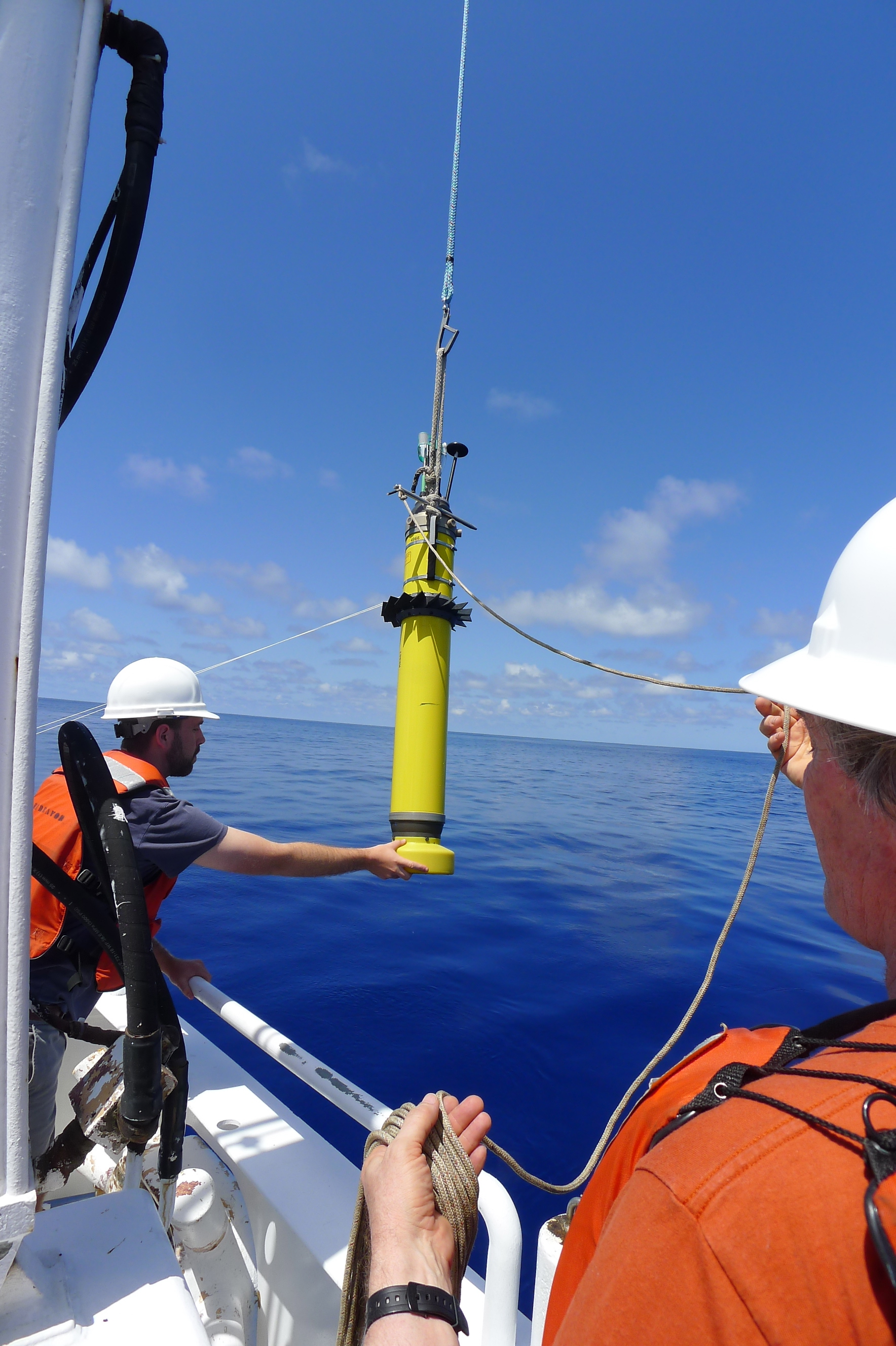 UW graduate student Nathan Lauffenburger and John Dunlap, APL principal engineer, launch one of the profilers.
