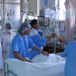 Staff surround a traumatic brain injury patient at Hospital Japones in Bolivia.