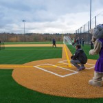 Catcher and mascot behind homeplate of new field