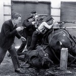 A guard takes cover behind dead horses in 1936 during the Spanish Civil War.