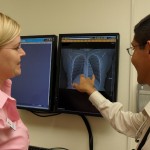 UW Dr. Hollie Matthews works with student David Lepez in Moses Lake in 2010.