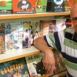 Shelves of books and head shot of author