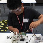 Alexander Riley works on the ROV during summer camp.