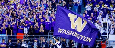 Cheerleader carriers UW flag