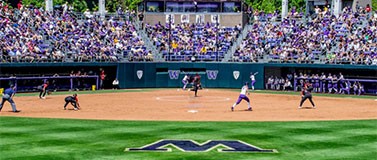 A photo of the UW Softball stadium looking from the outfield toward home plate.