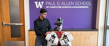 UW professor Siddhartha Srinivasa with HERB (Home Exploring Robot Butler)