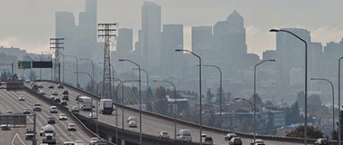 Cars travel on I-5 in Seattle