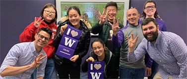 Group holding 'I love UW' posters
