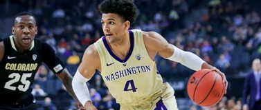 Matisse Thybulle running with basketball, Colorado player McKinley Wright IV in the background