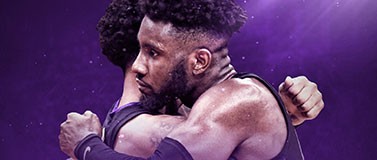 Huskies basketball player embrace following loss to UNC in the NCAA Tournament