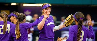 UW Softball players celebrate a win in the NCAA regionals.