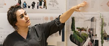 woman with hand on a paper presentation