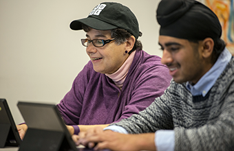 UW President Ana Mari Cauce and students participate in the Hour of Code