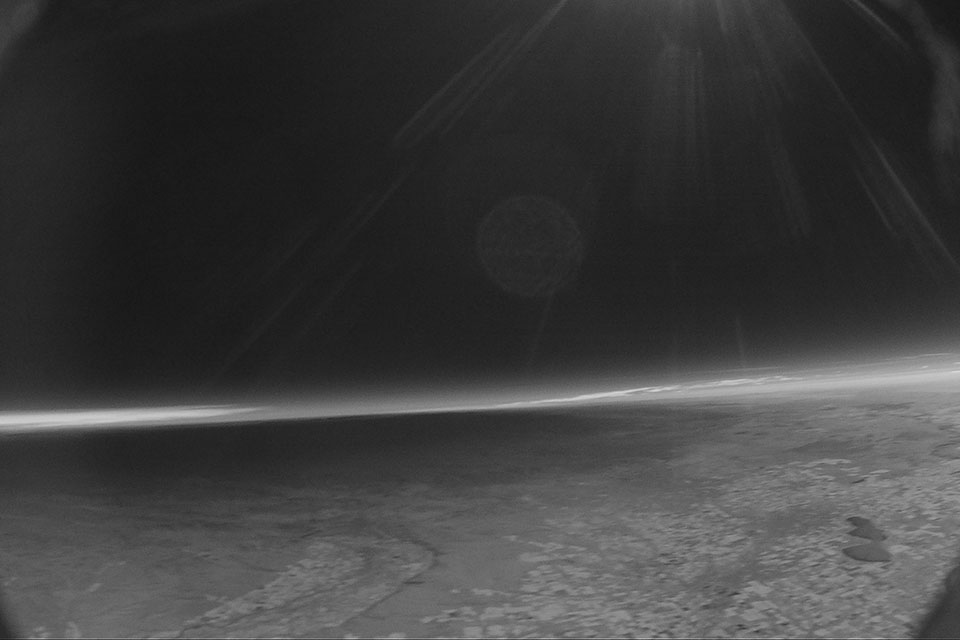 At an altitude of 45,000 feet, the balloon records the moon’ shadow traveling east towards Idaho Falls. The Emmett Valley is visible at the bottom center of the image and Lake Lowell appears as the dark patch at the lower right. Individual farm fields appear as the white blocks around Lake Lowell and Emmett.