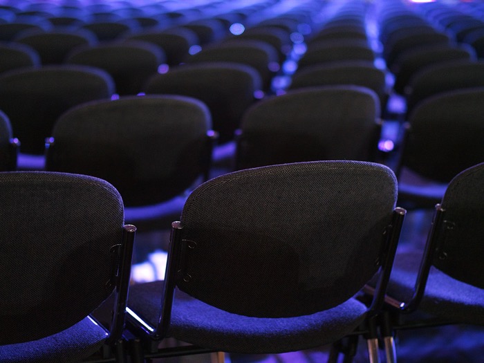 Empty chairs at a conference