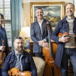 chamber musicians in denim outfits