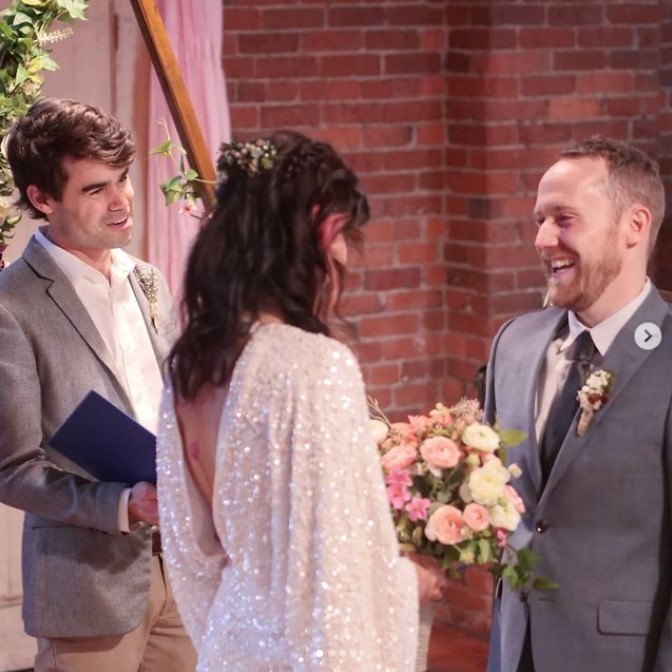 Photograph of AMM's Director and Minister Lewis King performing a wedding ceremony for friends in the American Marriage Ministries office in Seattle, WA