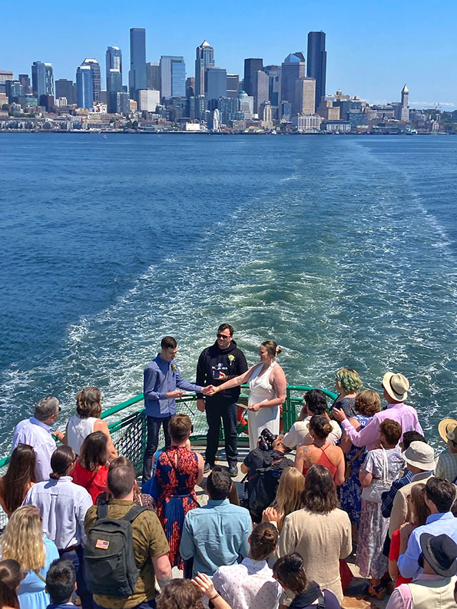 Photograph of a couple getting married about a ferry in Seattle's Puget Sound