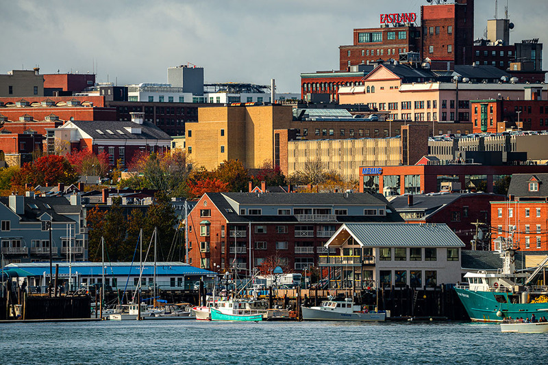 A view of Portland, Maine taken from the water on a clear day with light cloud cover