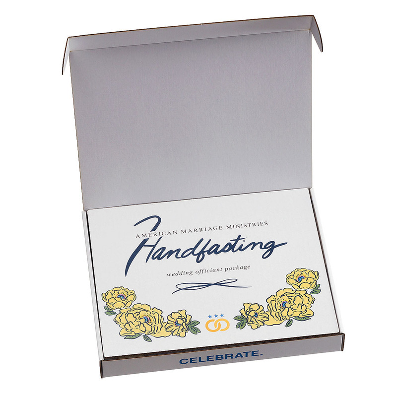 A photo showing the inside of the AMM Handfasting kit, with an illustrated insert and script lettering