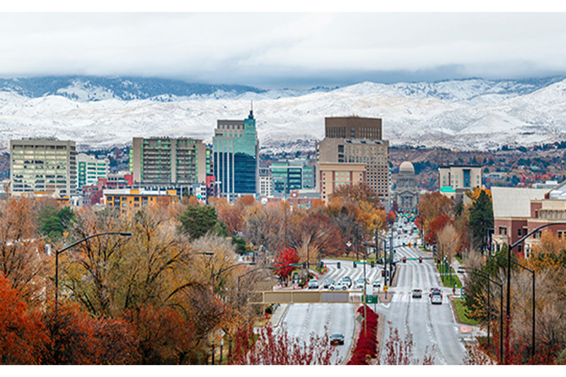 Aerial view of downtown Boise, Idaho, with mountains in the background