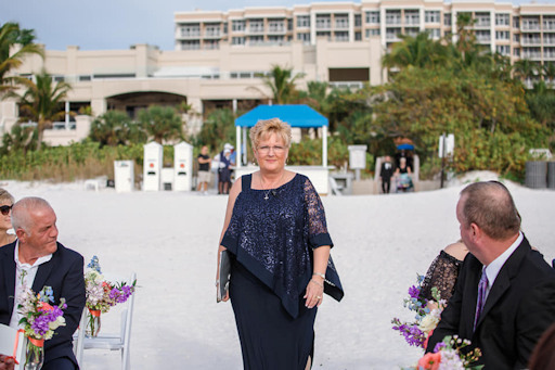 AMM Minister and wedding officiant Bonnie Sanchez on a beach in Florida at the start of a large wedding ceremony