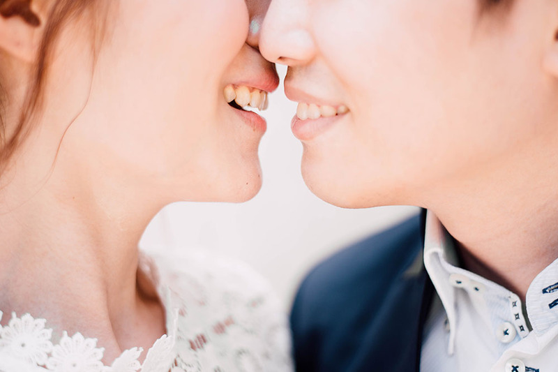 Close up photo of bride and grooms lips as they are about to kiss