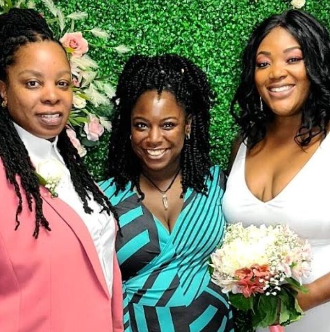 AMM Officiant Latrice Roman at Put a Ring on it Dallas poses with two brides following their elopement ceremony 