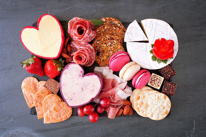 Image of different cheeses and snacks for a cheese themed wedding