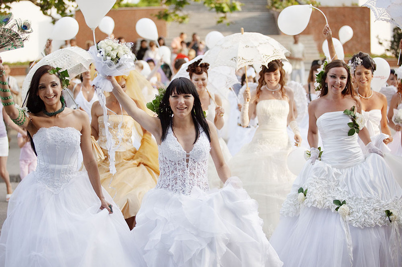 A group of brides gathered for a group wedding