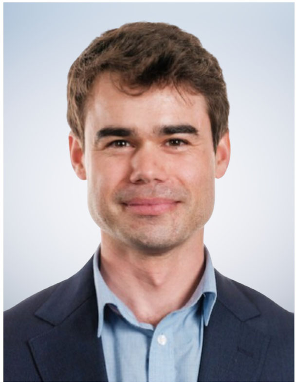 AMM's Executive Director Lewis King smiles toward the camera in a professional headshot