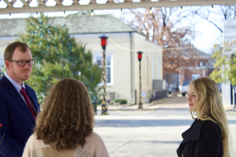 Wedding photo shows Notary Officiant Kimberely Boren officiating a ceremony for a bride and groom