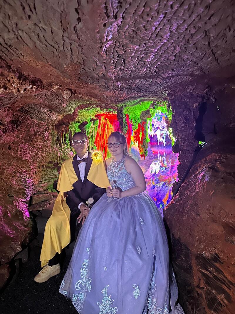 Brides Beka and Laura pose in the caverns among colorful stones