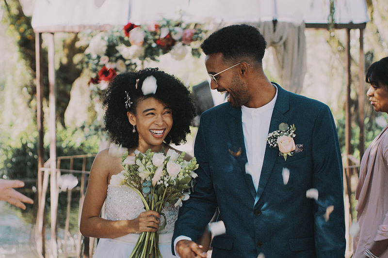 Bride and groom smile on the wedding day