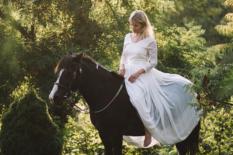 Bride on a horse in the forest