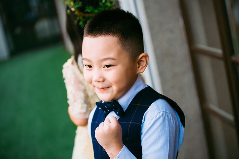 Young boy is ring bearer at a wedding ceremony