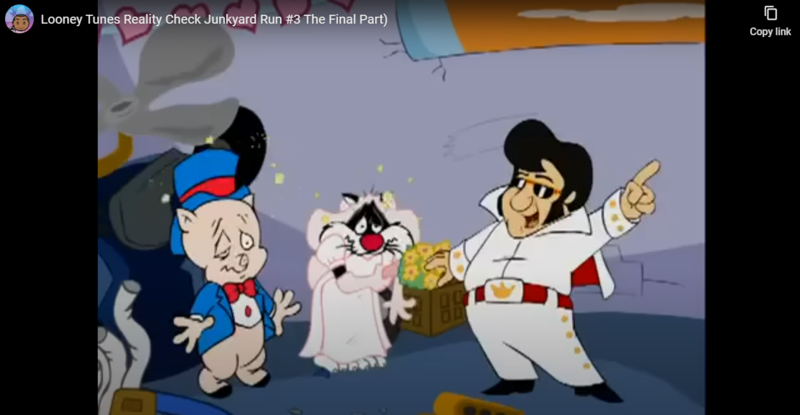 Screenshot from Looney Tunes Junkyard Run wedding scene with Elvis impersonator serving as the wedding officiant for Porky and Sylvester