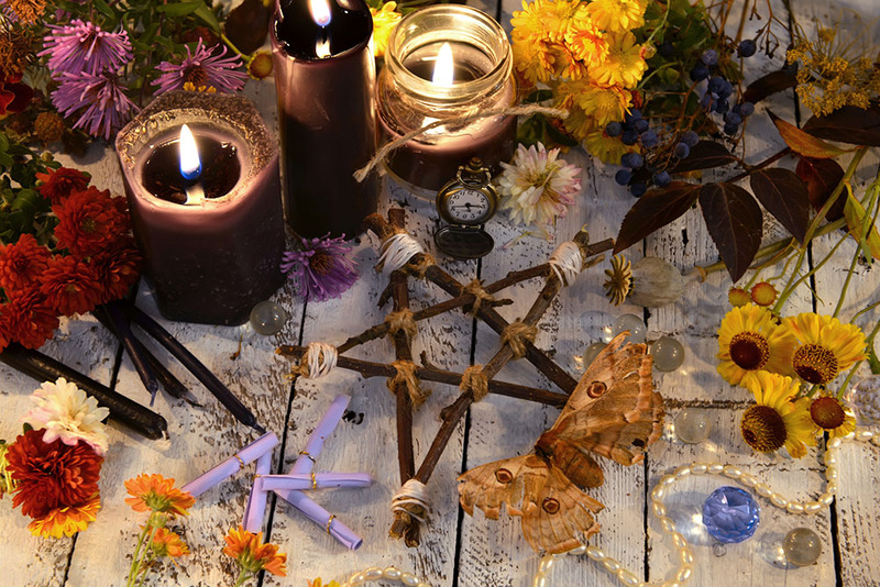 Close up of a wiccan wedding altar with flowers and candles