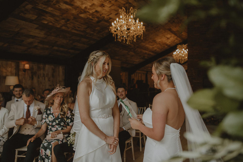 Two brides exchange wedding vows