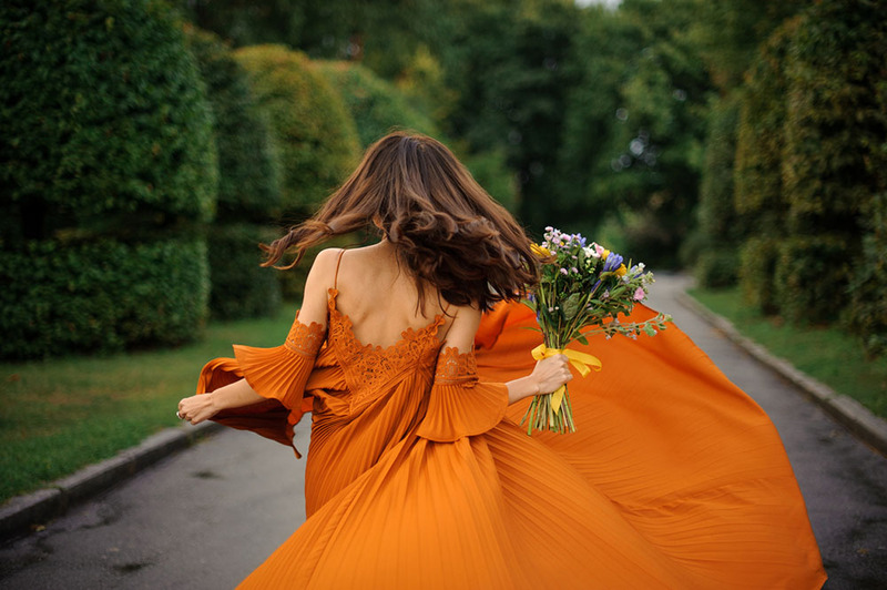 Bride in an orange wedding dress